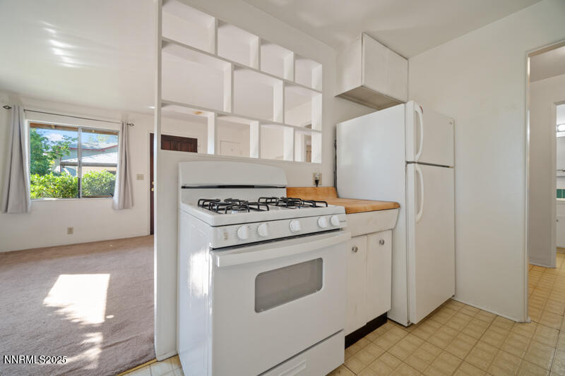 1245 Plumas Street Reno, NV 89509 - Photo 8 of 16 a kitchen with a stove and a refrigerator