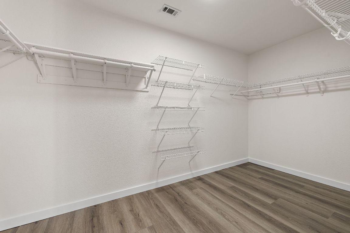 3219 Arroyo Bluff Lane Round Rock, TX 78681 - Photo 19 of 27 a view of a room with empty racks