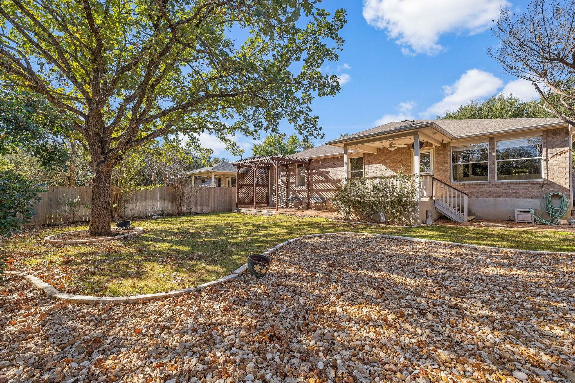 3219 Arroyo Bluff Lane Round Rock, TX 78681 - Photo 24 of 27 a view of a house with backyard and tree