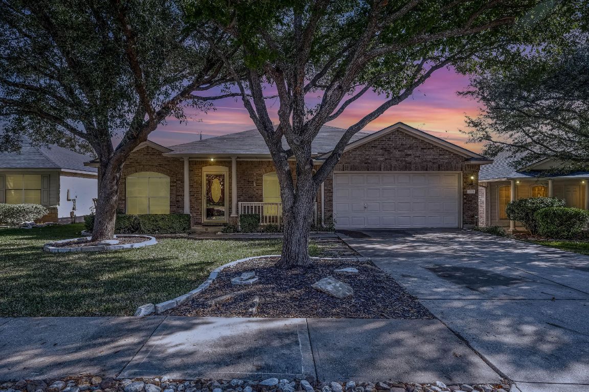 3219 Arroyo Bluff Lane Round Rock, TX 78681 - Photo 26 of 27 a house that has a tree in front of it