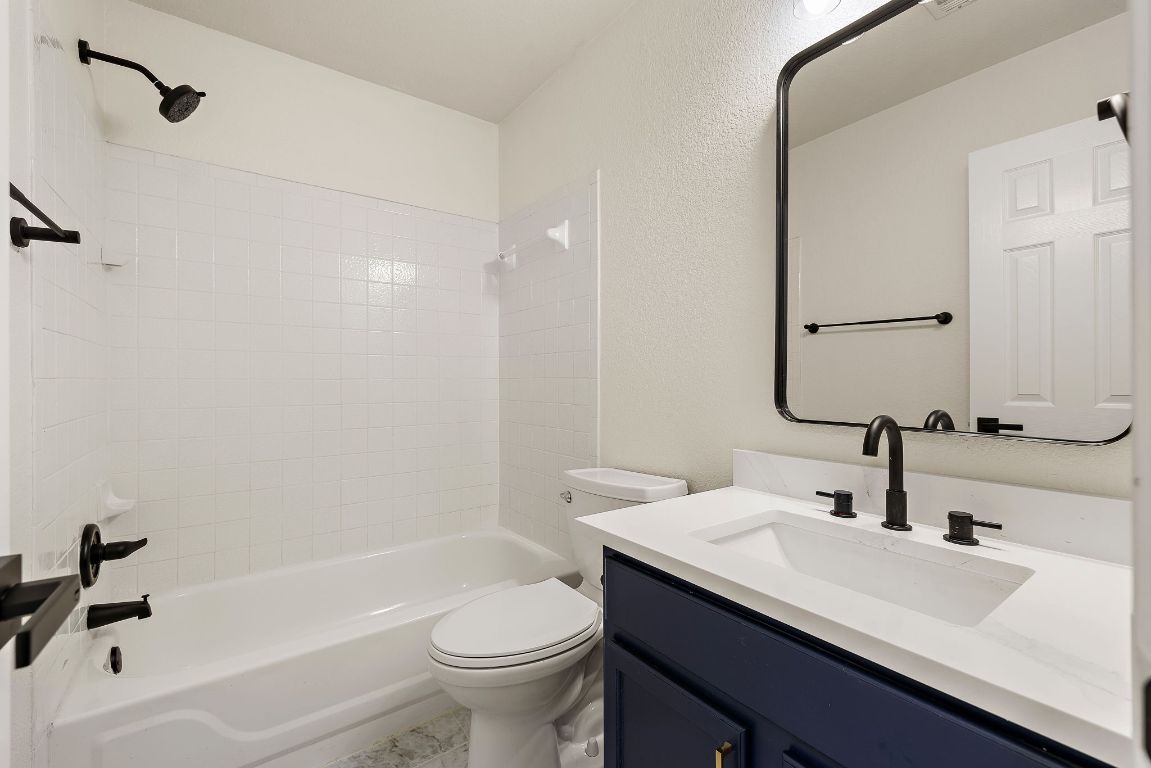 3219 Arroyo Bluff Lane Round Rock, TX 78681 - Photo 5 of 27 a bathroom with a sink and a mirror