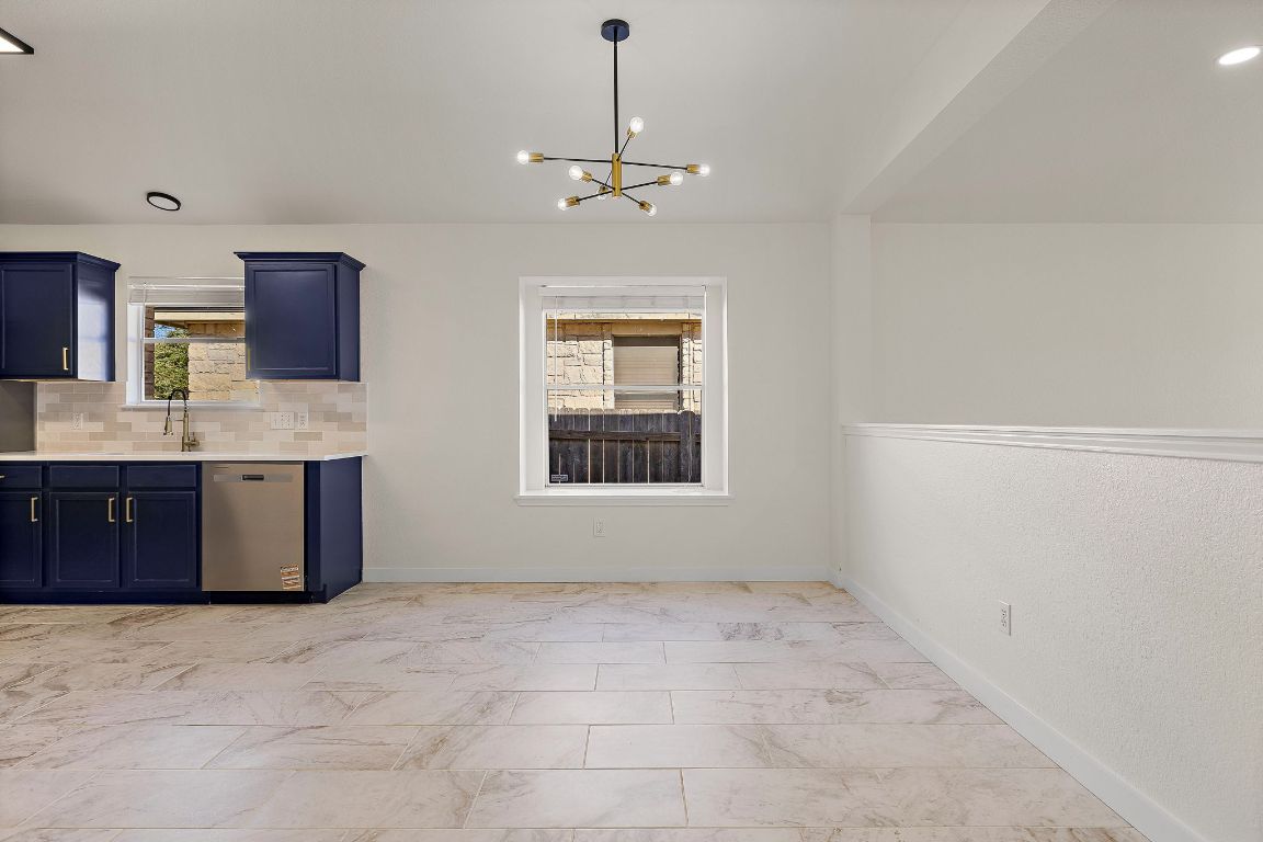 3219 Arroyo Bluff Lane Round Rock, TX 78681 - Photo 10 of 27 a view of a kitchen with a sink and cabinet