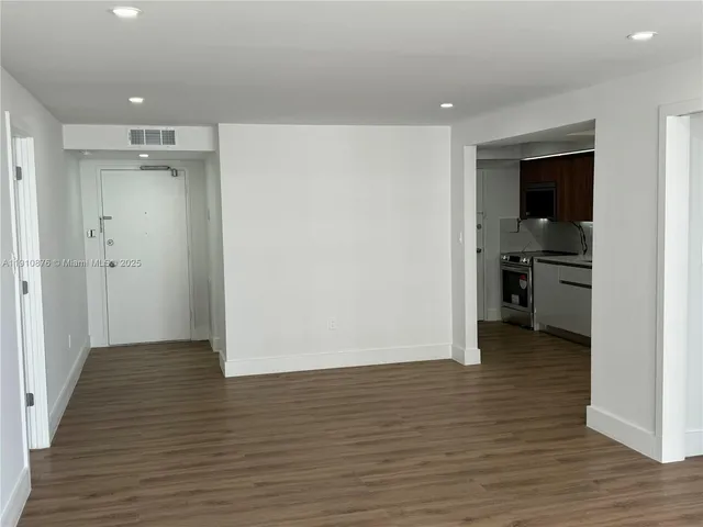 a view of a lake with tall buildings