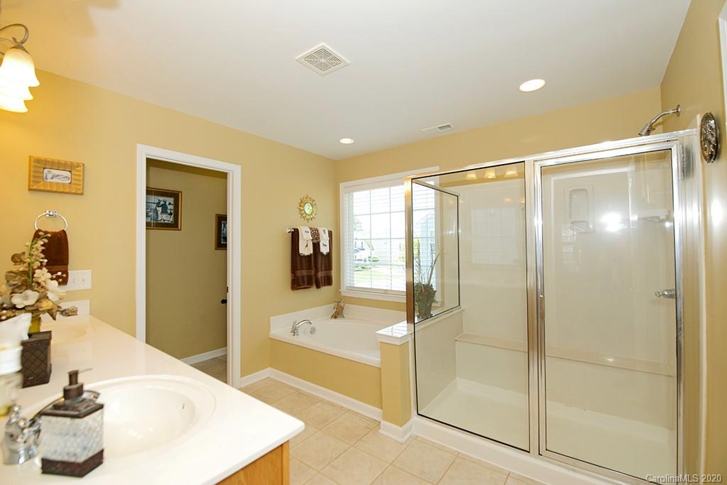 4322 Sunset Rose Drive Fort Mill, SC 29708 - Photo 13 of 34 a bathroom with a tub and shower