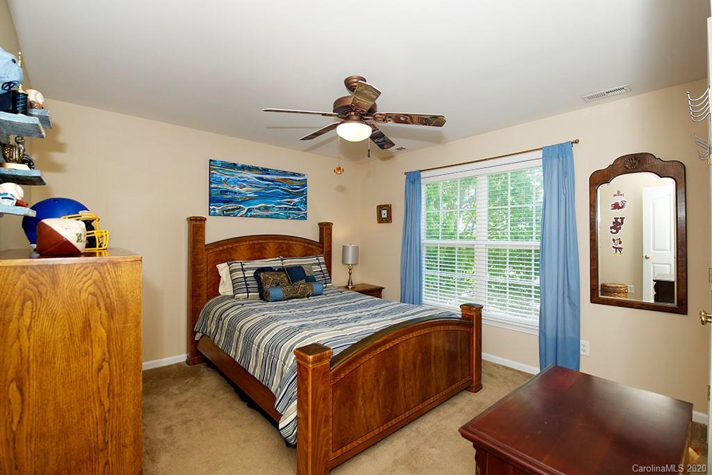 4322 Sunset Rose Drive Fort Mill, SC 29708 - Photo 19 of 34 a bedroom with a bed and a window