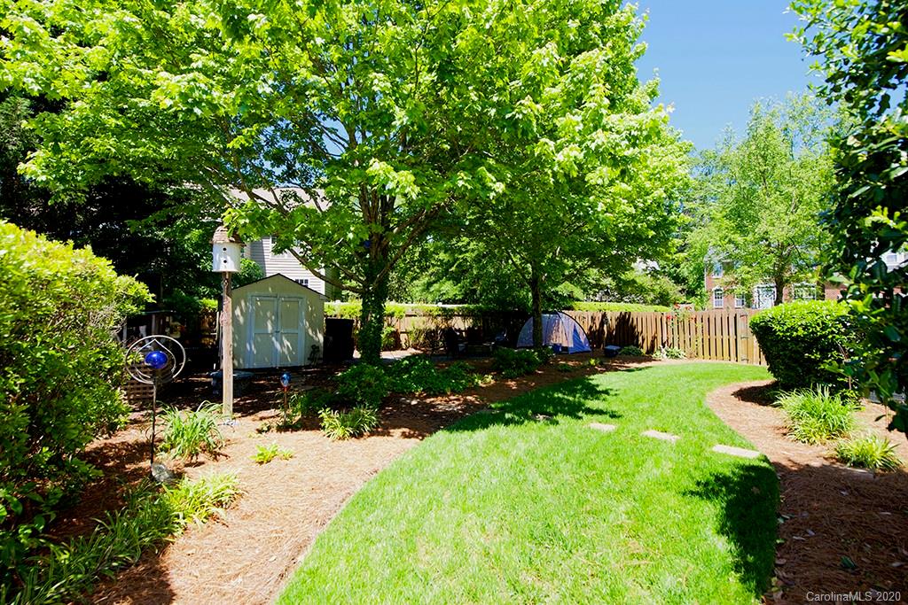 4322 Sunset Rose Drive Fort Mill, SC 29708 - Photo 27 of 34 a view of a garden with plants and large trees