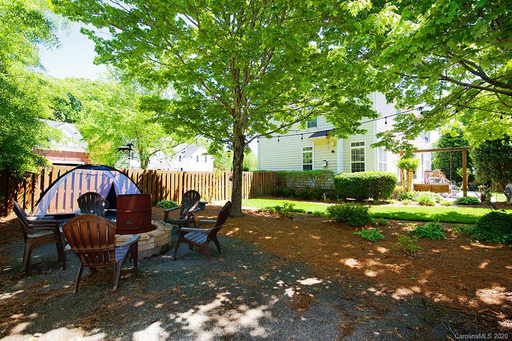 4322 Sunset Rose Drive Fort Mill, SC 29708 - Photo 28 of 34 a backyard of a house with table and chairs