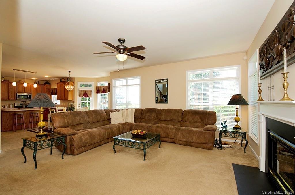 4322 Sunset Rose Drive Fort Mill, SC 29708 - Photo 10 of 34 a living room with furniture and a fireplace