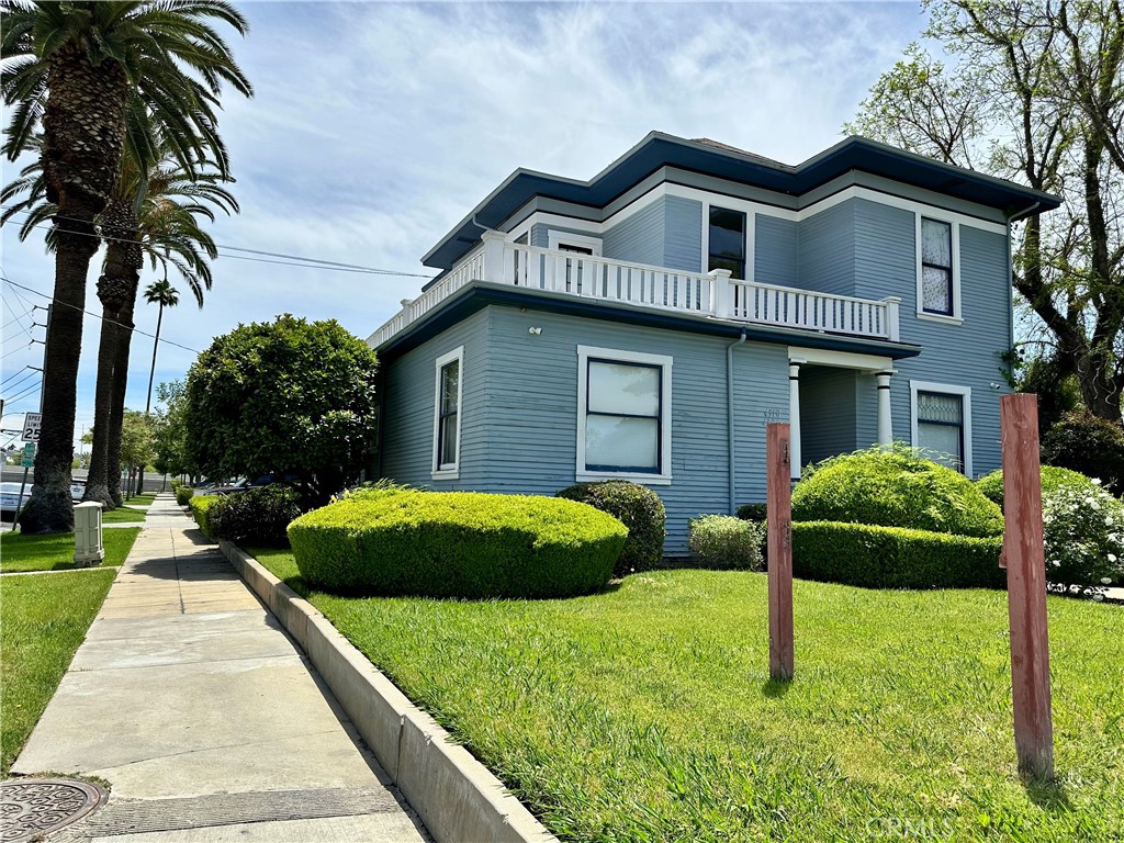 4308 Lime Street Riverside, CA 92501 - Photo 3 of 14 a front view of a house with a yard