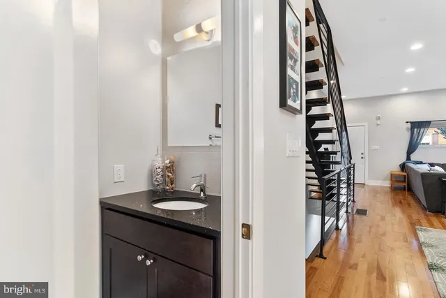 a bathroom with a sink and a mirror