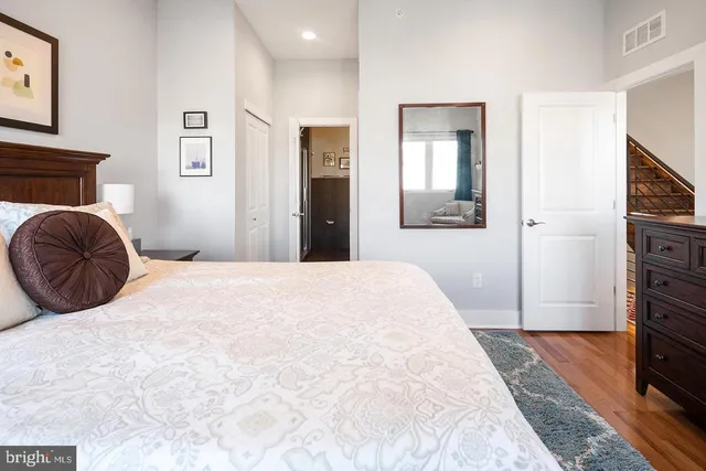 a bedroom with a bed and a dresser