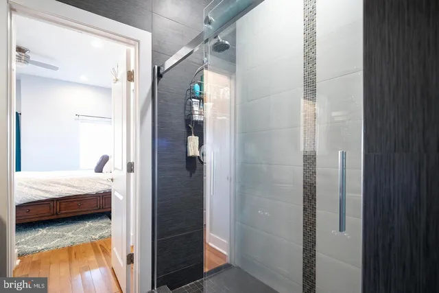 a bedroom with a bed and a mirror