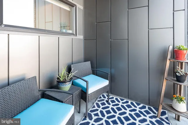 a bedroom with a bed and a chair