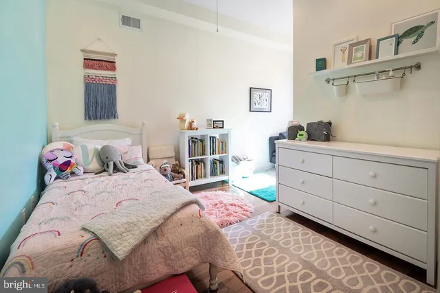 a bedroom with a bed and a cabinets