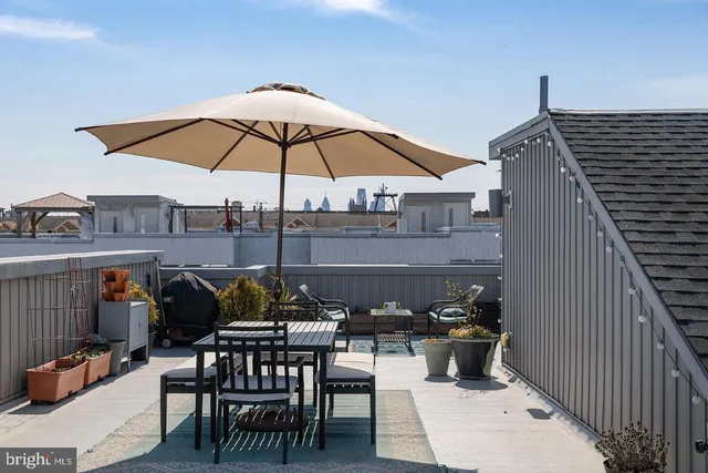a view of a terrace with furniture and a potted plant