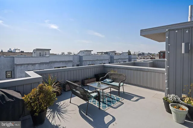 a bedroom with furniture and a rug