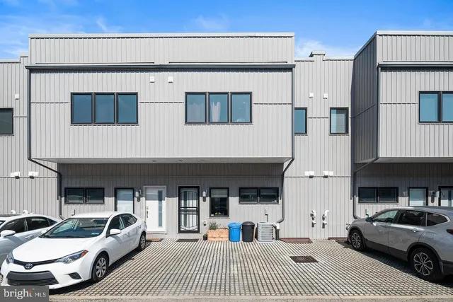 a view of the street with parked cars