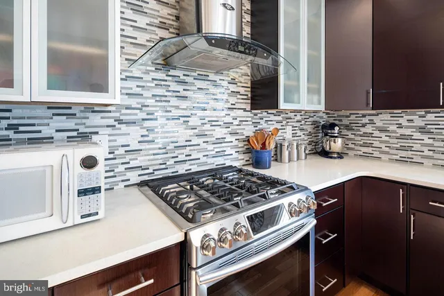 a kitchen with a stove and a sink