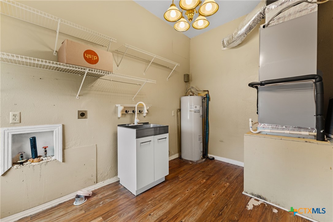 2967 South Old Robinson Road Lorena, TX 76655 - Photo 29 of 41 a view of a storage & utility room with wooden floor