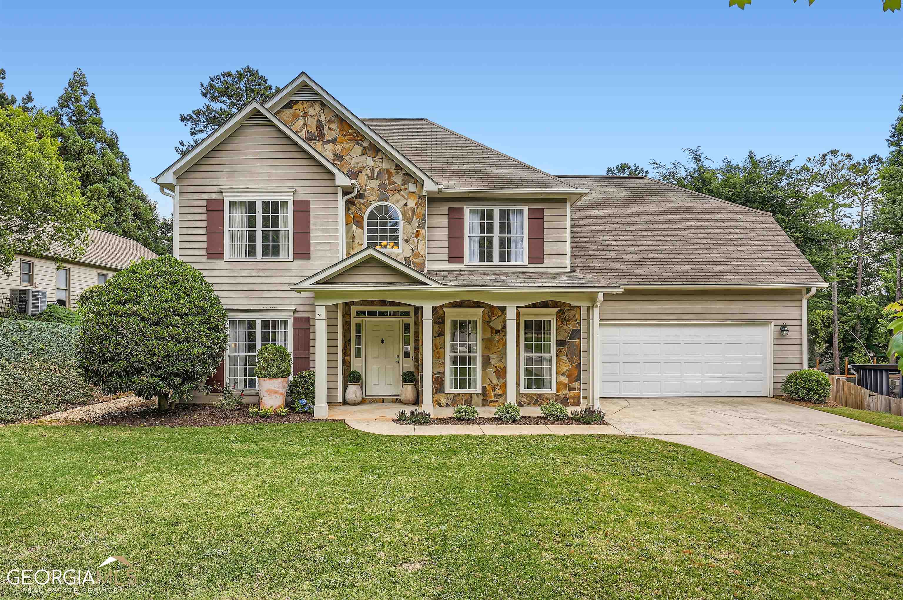 160 Terrane Ridge Peachtree City, GA 30269 - Photo 1 of 1 a front view of a house with a yard and garage