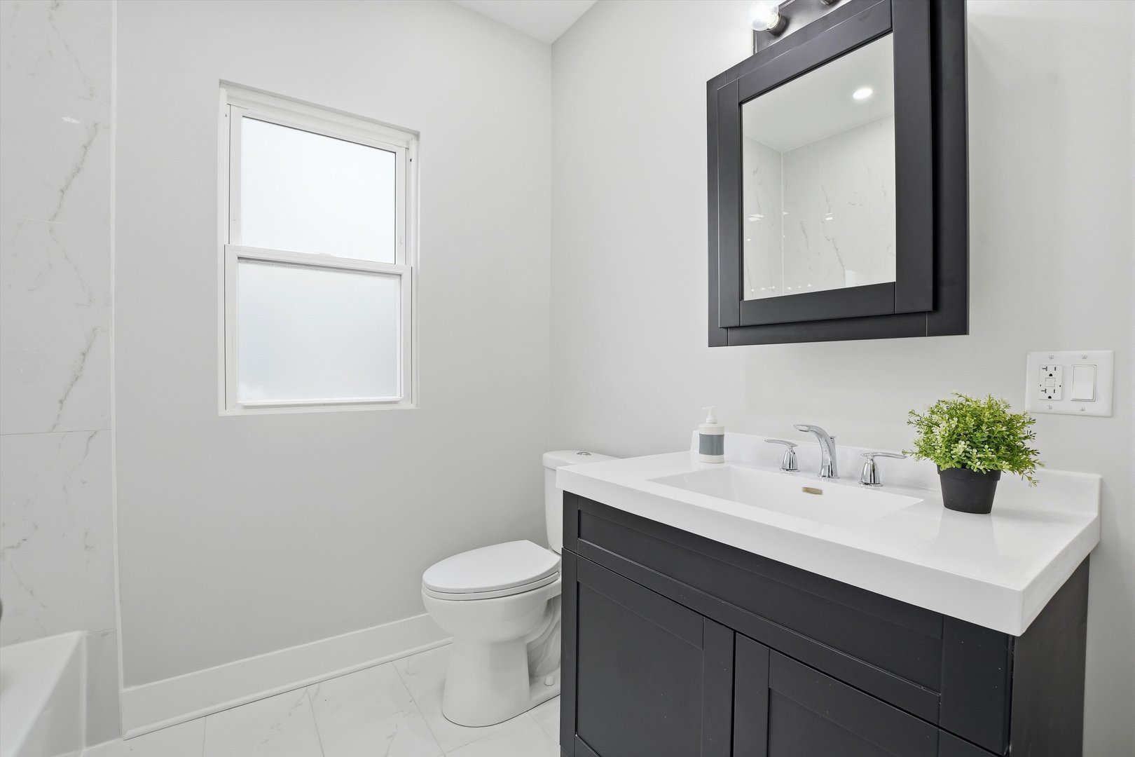 9953 South Prospect Avenue Chicago, IL 60643 - Photo 14 of 35 a bathroom with a toilet sink vanity and mirror