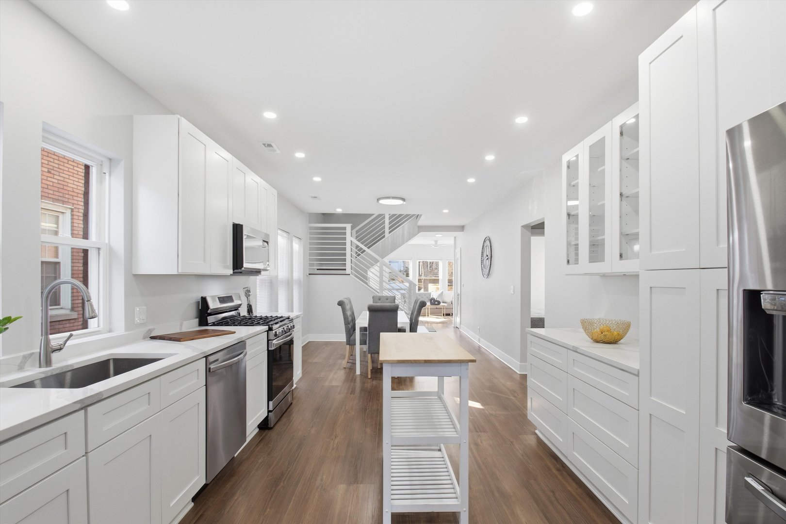 9953 South Prospect Avenue Chicago, IL 60643 - Photo 8 of 35 a large white kitchen with stainless steel appliances