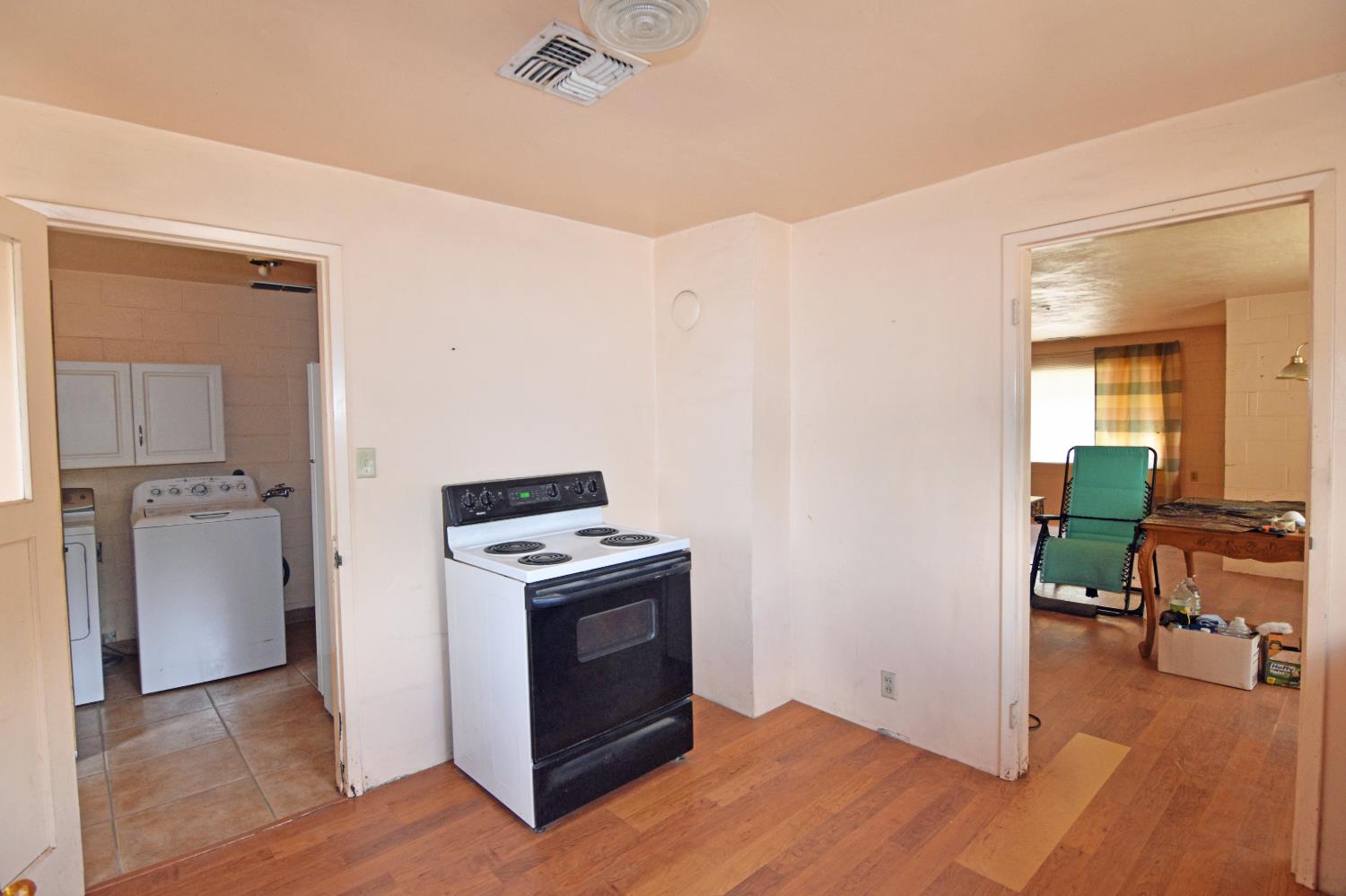 1206 South Verduga Road Turlock, CA 95380 - Photo 11 of 36 a view of kitchen and wooden floor