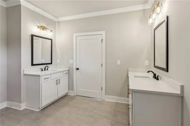 a bathroom with a double vanity sink and mirror