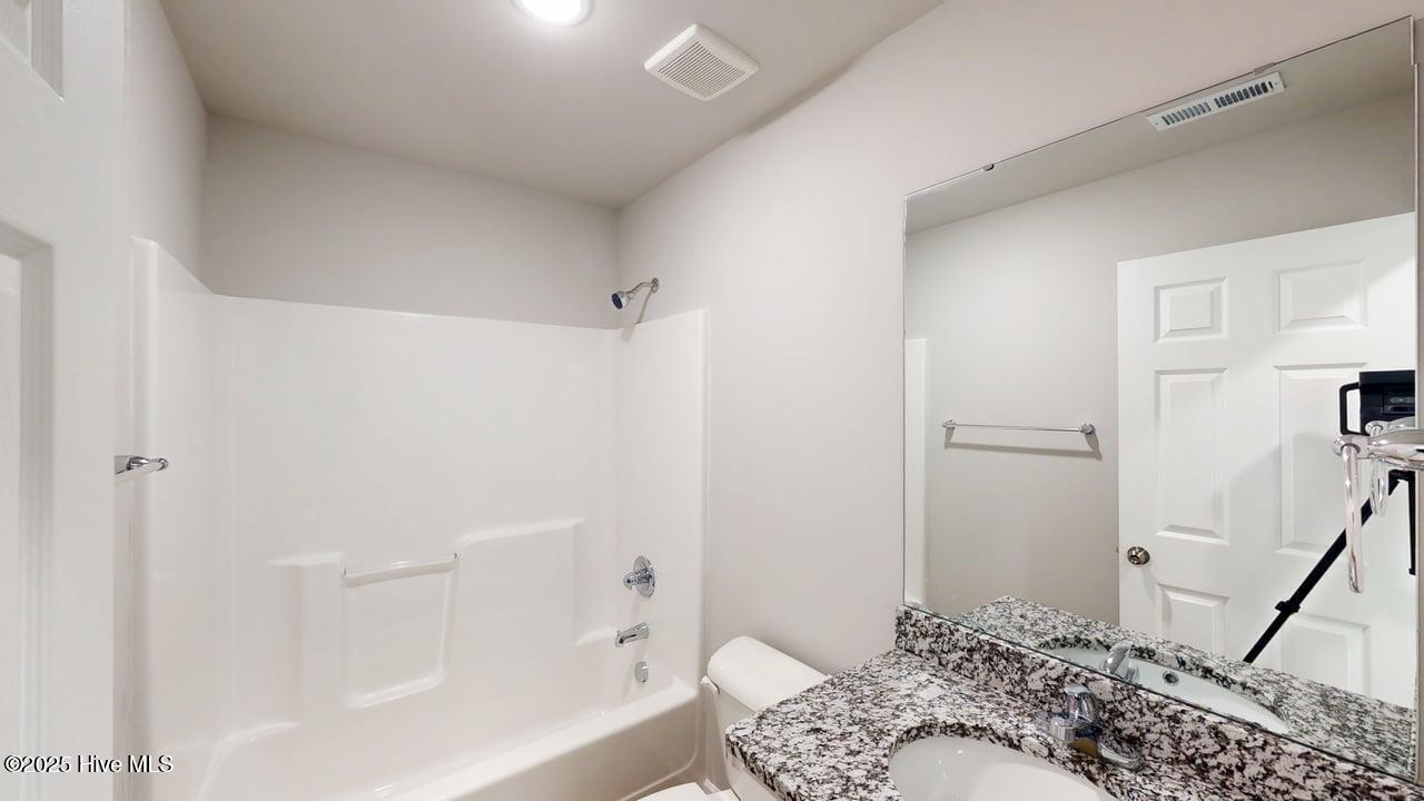 1391 Pinkney Road Pikeville, NC 27863 - Photo 15 of 29 Hall Bathroom