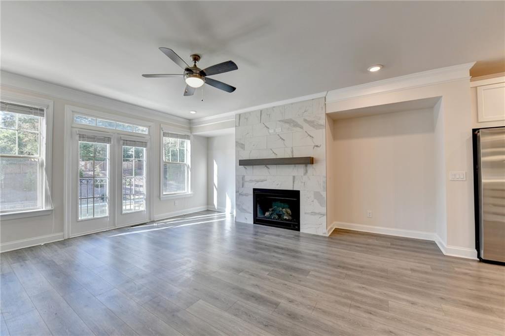 3159 Clairebrooke Avenue Atlanta, GA 30341 - Photo 12 of 36 a view of an empty room with wooden floor and a window