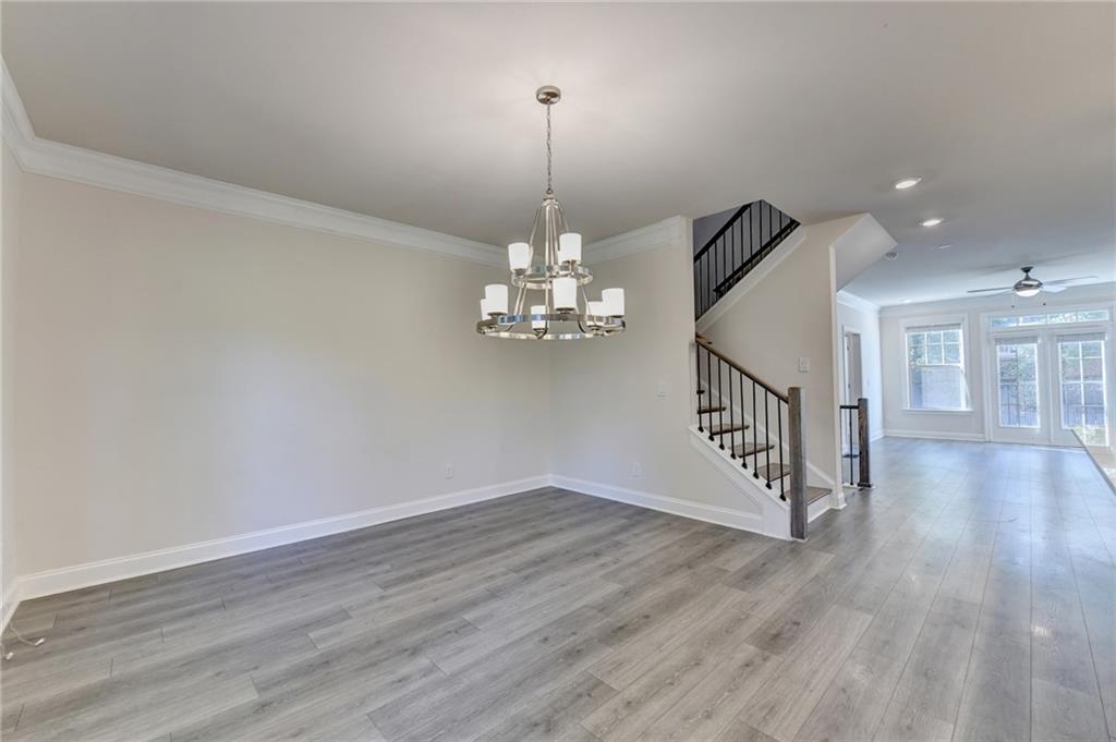 3159 Clairebrooke Avenue Atlanta, GA 30341 - Photo 15 of 36 a view of a room with wooden floor chandelier and entryway