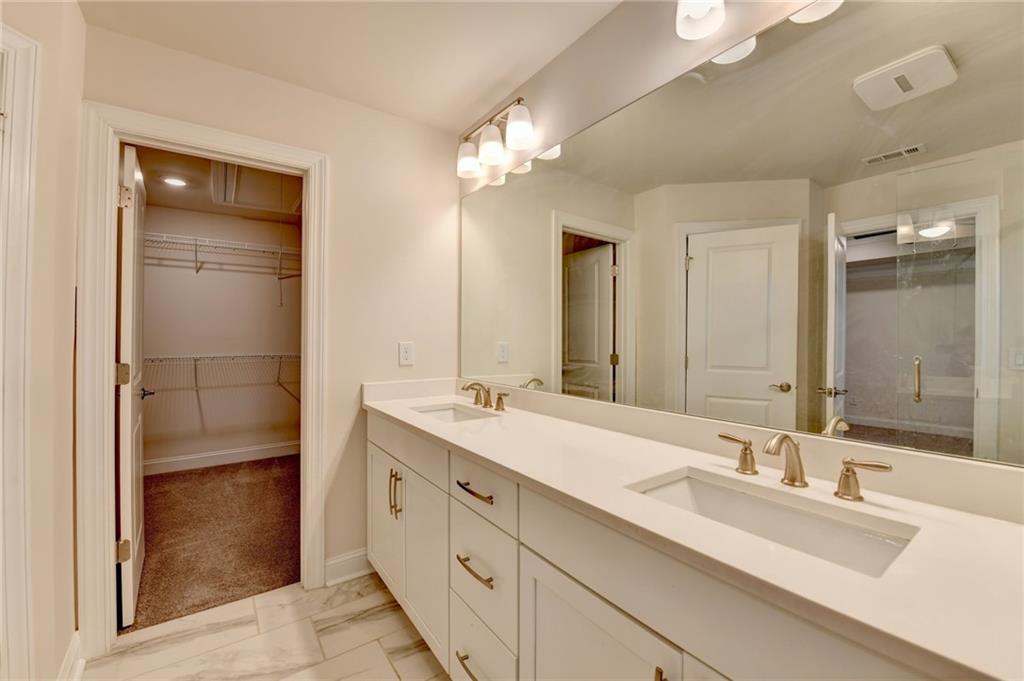 3159 Clairebrooke Avenue Atlanta, GA 30341 - Photo 22 of 36 a bathroom with a double vanity sink and a mirror
