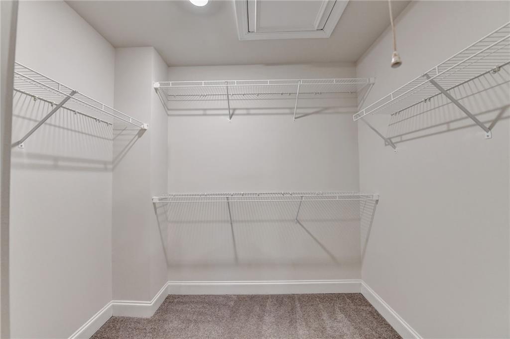 3159 Clairebrooke Avenue Atlanta, GA 30341 - Photo 23 of 36 a view of walk in closet with empty racks