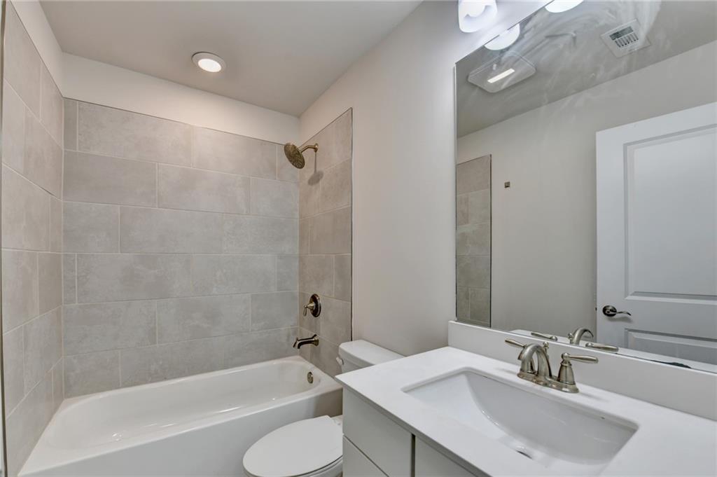 3159 Clairebrooke Avenue Atlanta, GA 30341 - Photo 28 of 36 a bathroom with a sink a toilet and shower