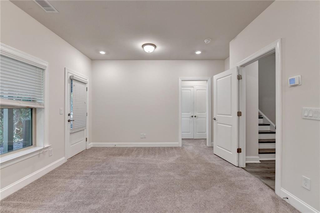 3159 Clairebrooke Avenue Atlanta, GA 30341 - Photo 29 of 36 an empty room with closet and wooden floor