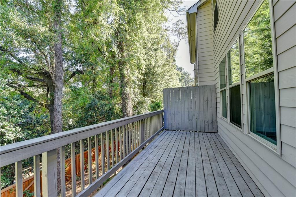 3159 Clairebrooke Avenue Atlanta, GA 30341 - Photo 33 of 36 a balcony with wooden floor and fence