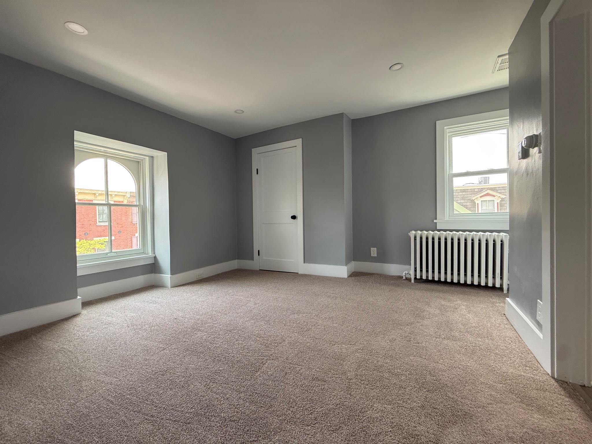 25 West State Street Doylestown, PA 18901 - Photo 4 of 10 Bright & airy living room with plush new carpet.