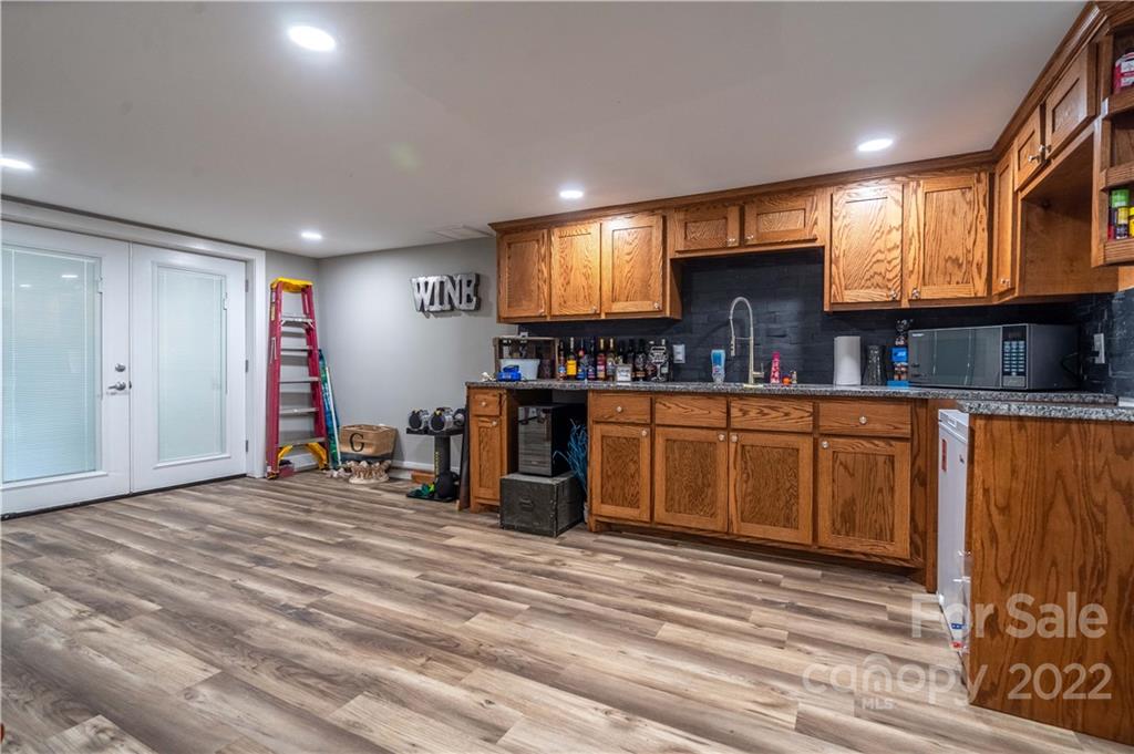 53 Forest Avenue Granite Falls, NC 28630 - Photo 19 of 37 a view of a kitchen with furniture and a window