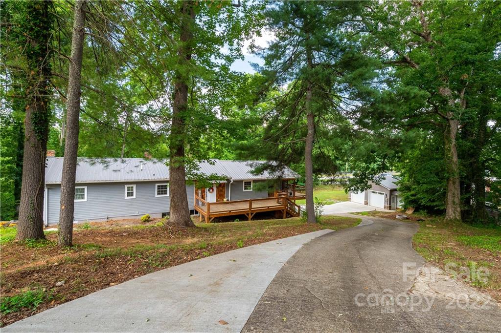53 Forest Avenue Granite Falls, NC 28630 - Photo 35 of 37 a front view of a house with a yard and large tree