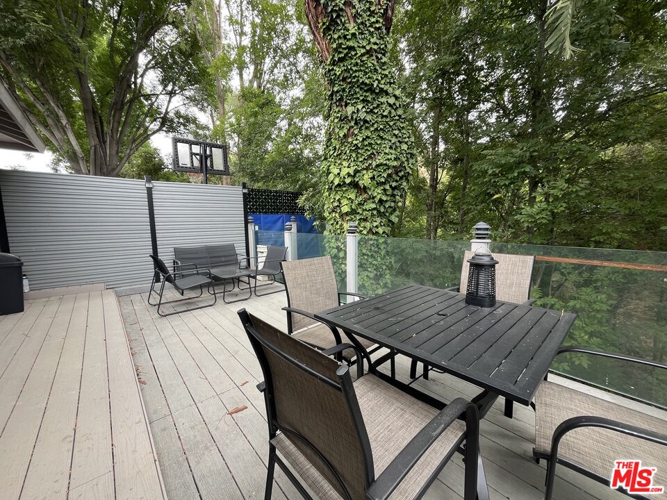 3708 Woodcliff Road Sherman Oaks, CA 91403 - Photo 10 of 14 a view of backyard with a patio and wooden floor