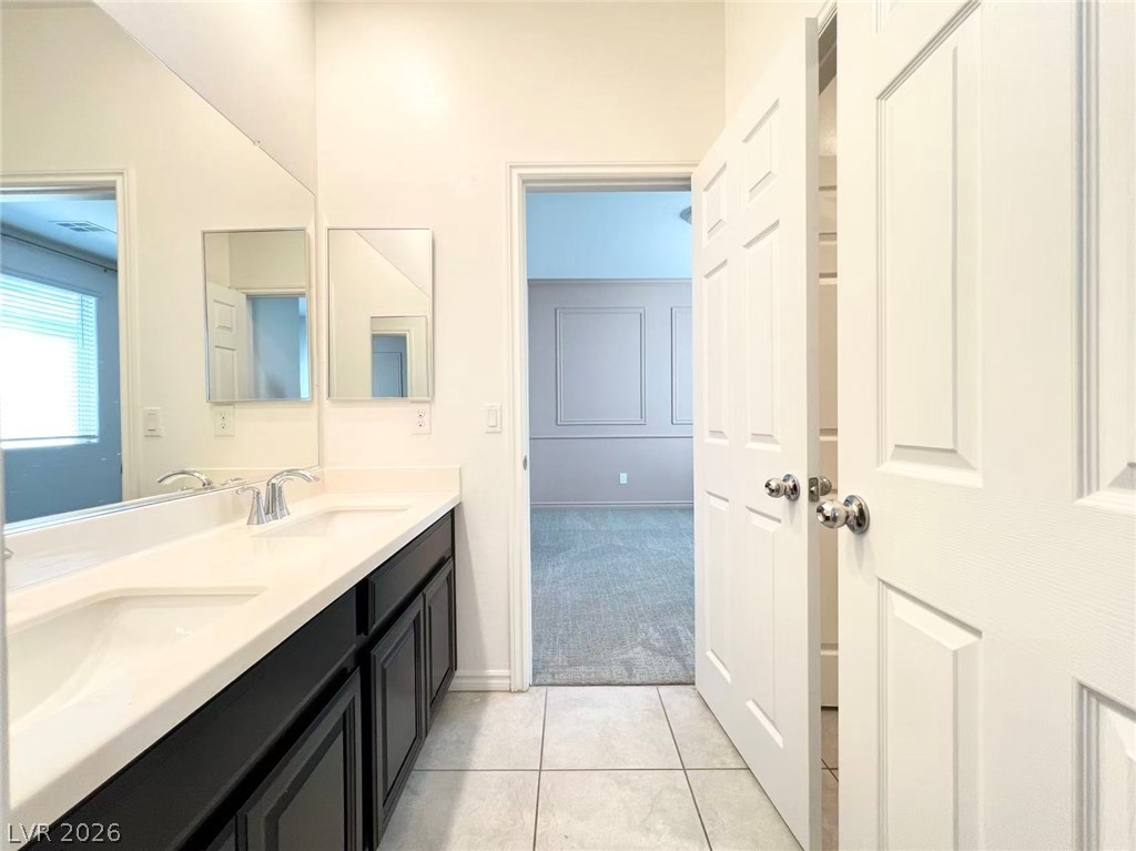 925 Bayberry Ridge Street Henderson, NV 89052 - Photo 22 of 27 Double vanity in this primary bathroom offers ample counter space for daily routines.