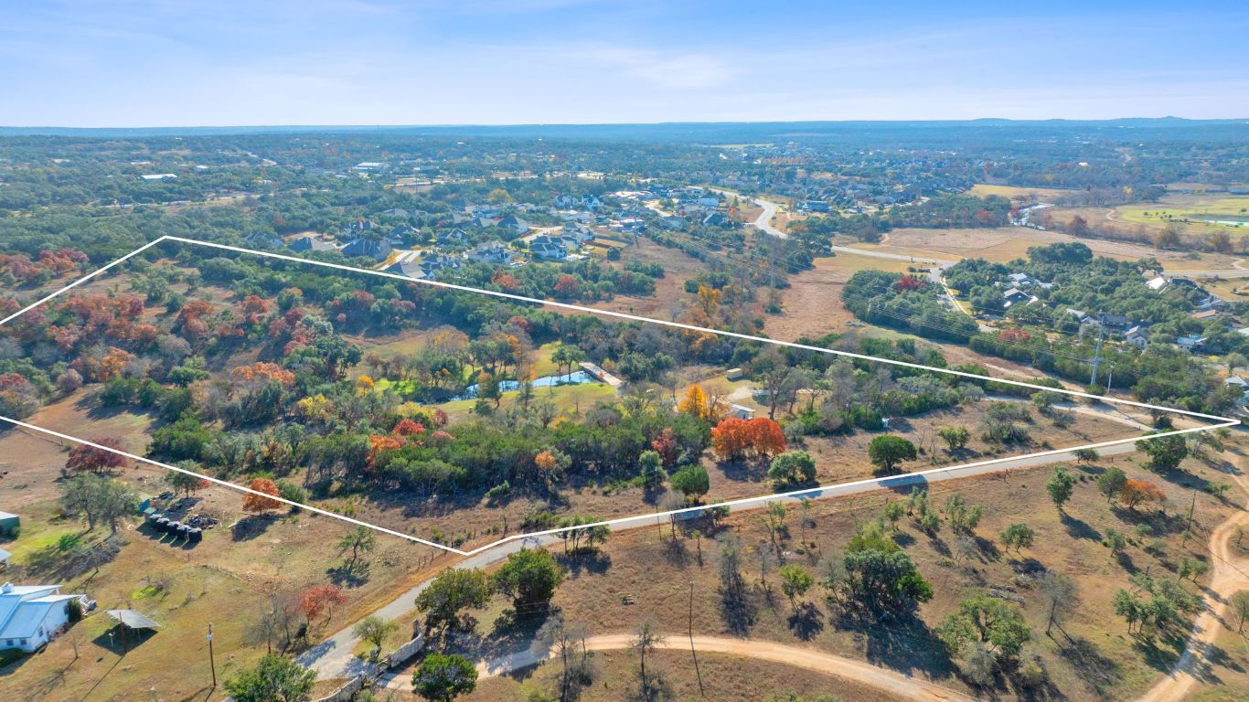 801 Needham Road Dripping Springs, TX 78620 - Photo 2 of 36 Aerial view of property and surrounding area featuring property boundaries highlighted
