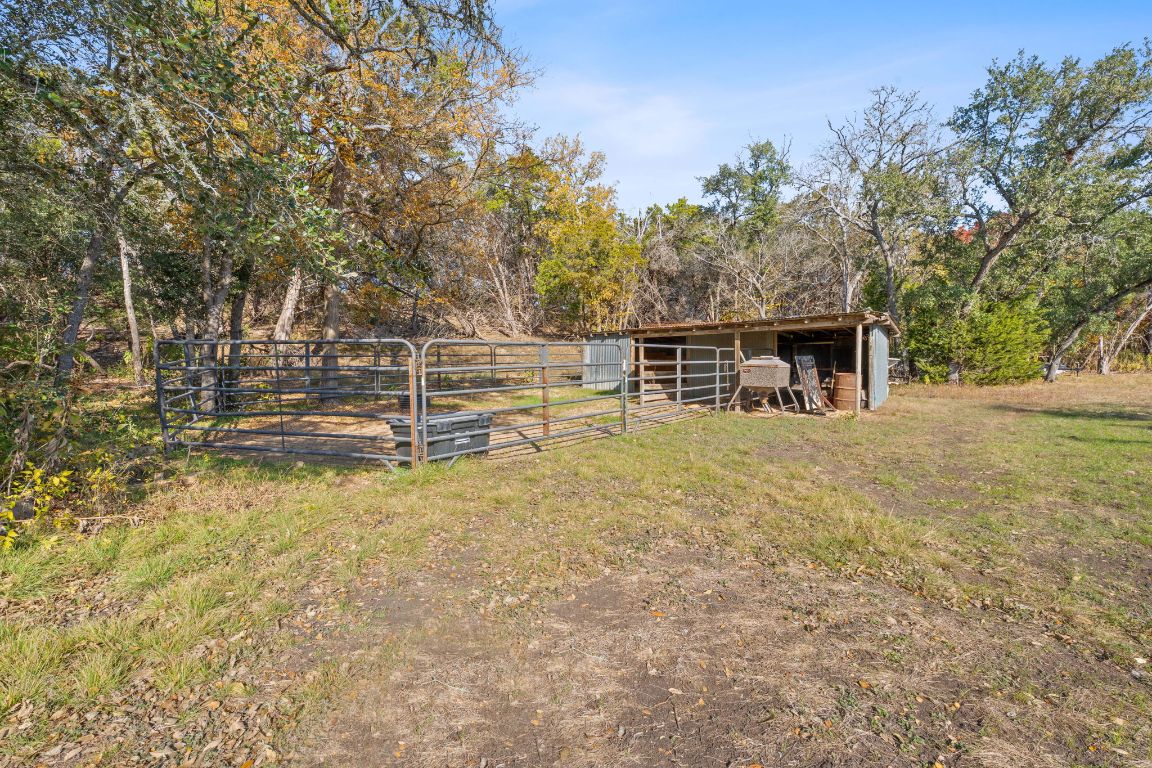 801 Needham Road Dripping Springs, TX 78620 - Photo 34 of 36 View of yard with an outdoor structure
