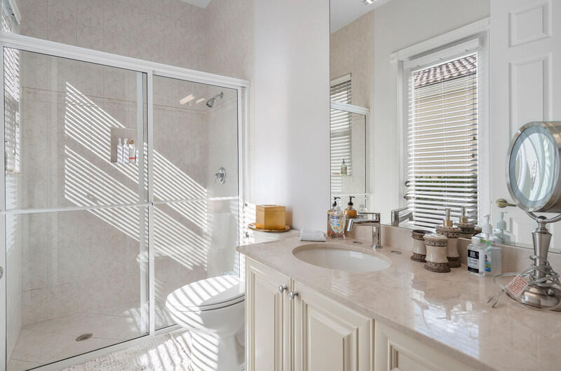 14364 Stroller Way Wellington, FL 33414 - Photo 25 of 47 a bathroom with a granite countertop sink and a mirror