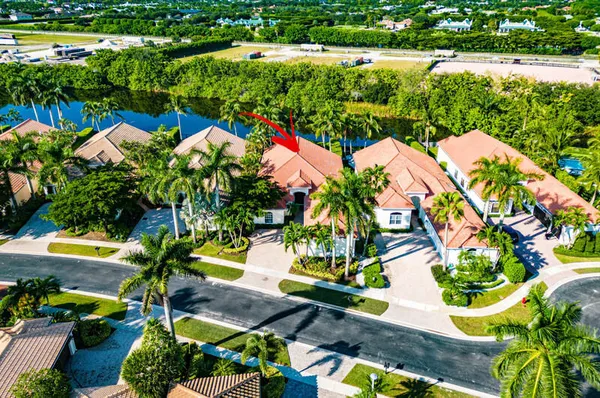 a view of a house with swimming pool and porch with furniture