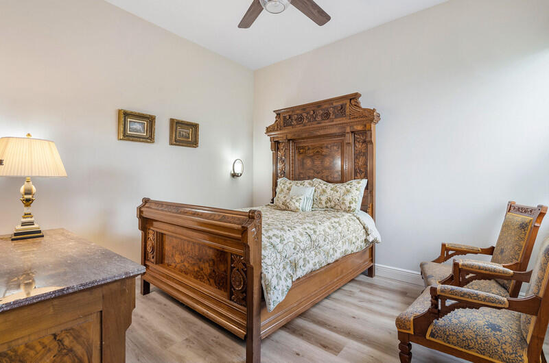 14364 Stroller Way Wellington, FL 33414 - Photo 30 of 47 a bedroom with a bed and chair