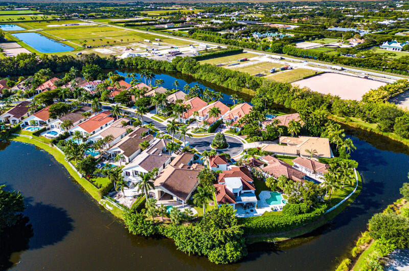 14364 Stroller Way Wellington, FL 33414 - Photo 3 of 47 an aerial view of residential houses with outdoor space and swimming pool