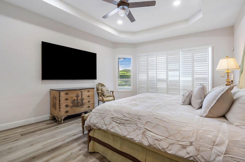 14364 Stroller Way Wellington, FL 33414 - Photo 41 of 47 a bedroom with a bed and a flat screen tv