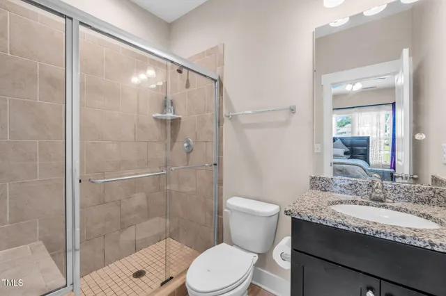a bathroom with a sink a mirror and toilet