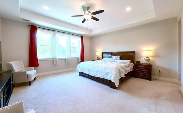 a spacious bathroom with a granite countertop tub and a large mirror